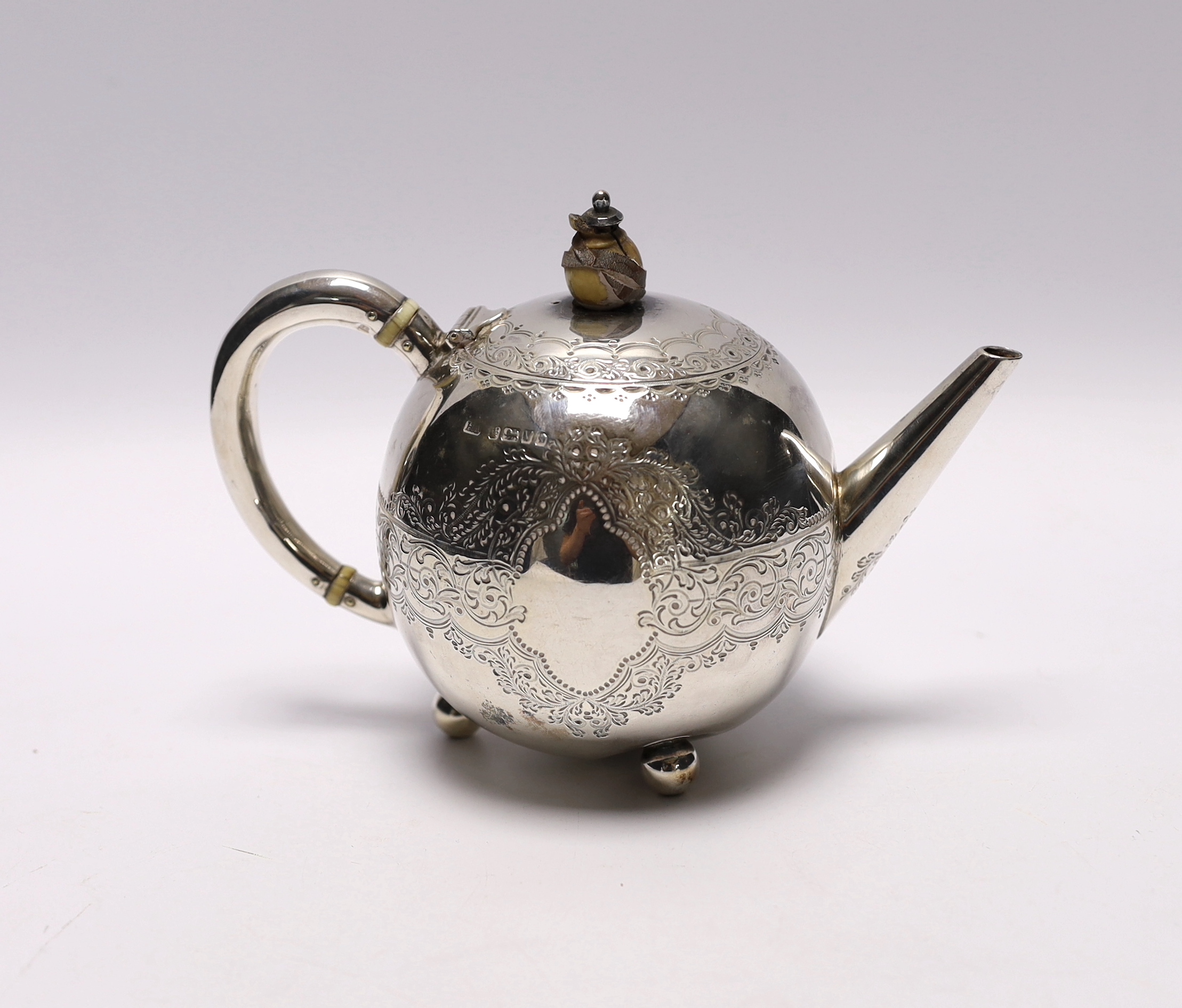 A late Victorian silver bullet shaped teapot, by Atkin Brothers, Sheffield, 1888, with engraved inscription and ivory knop, gross weight 7.2oz. CITES Submission reference A9RF9HKP